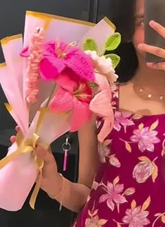 Pink crochet tulip and lily bouquet in paper wrap
